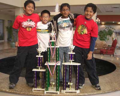 Akhil Kalghatgi, Jonathan Tan, Ranadheer Tripuraneni and Nikhil Kalghatgi show off their trophies.