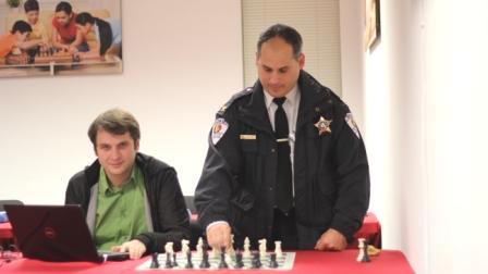 Skokie, Illinois Deputy Police Chief Michael Pechter opens the match for GM Yury Shulman